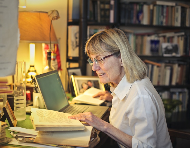 older-woman-writing-a-book